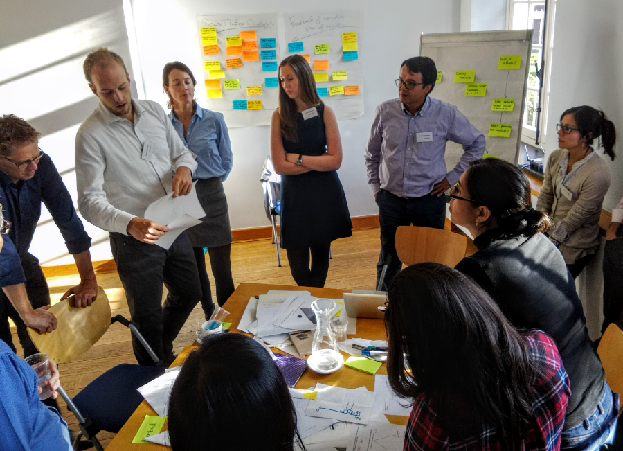 Tom consulting with a team